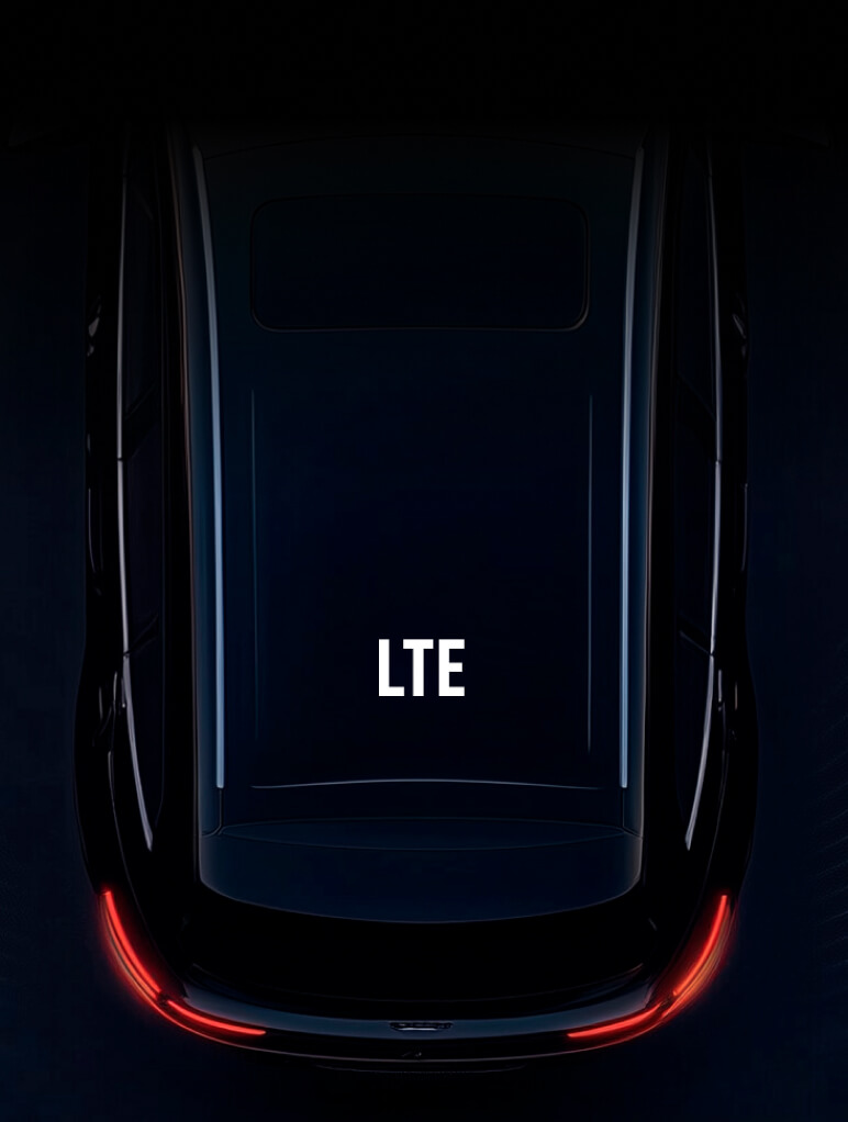 A sleek, glossy car roof with the letters "LTE" displayed prominently in the center. The surrounding area is dark, highlighting the car's shiny surface and subtle rear red lights at the bottom.